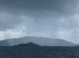 Gorda gets rain behind one of the Dog islands.