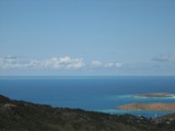 A rare view of Anegada ("the drowned island")from the top of Virgin Gorda. It's visible middle left to center.