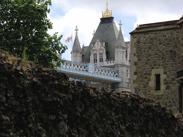 Tower bridge behind ancient wall in the Tower