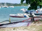 After we checked in at the airport, we had a few hours to kill. Trellis Bay, with its artists' colony, is a 5 minute walk from the airport. The sign on the little outboard is amusing: "Windsurfing Lessons, Trellis Bay CyberCafe"