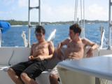 Ross and Stephen philosophize in front of the dinghy davits. Ross's eight-pack clearly visible.