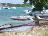 After we checked in at the airport, we had a few hours to kill. Trellis Bay, with its artists' colony, is a 5 minute walk from the airport. The sign on the little outboard is amusing: "Windsurfing Lessons, Trellis Bay CyberCafe"